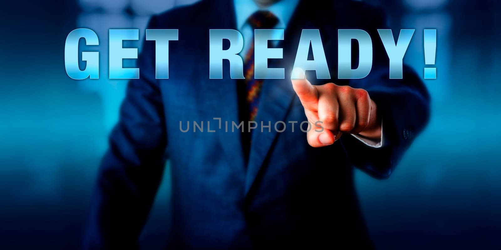 Corporate coach is touching GET READY! on a virtual interactive display. Motivational appeal, call to action and business concept for preparation in anticipation of future events.