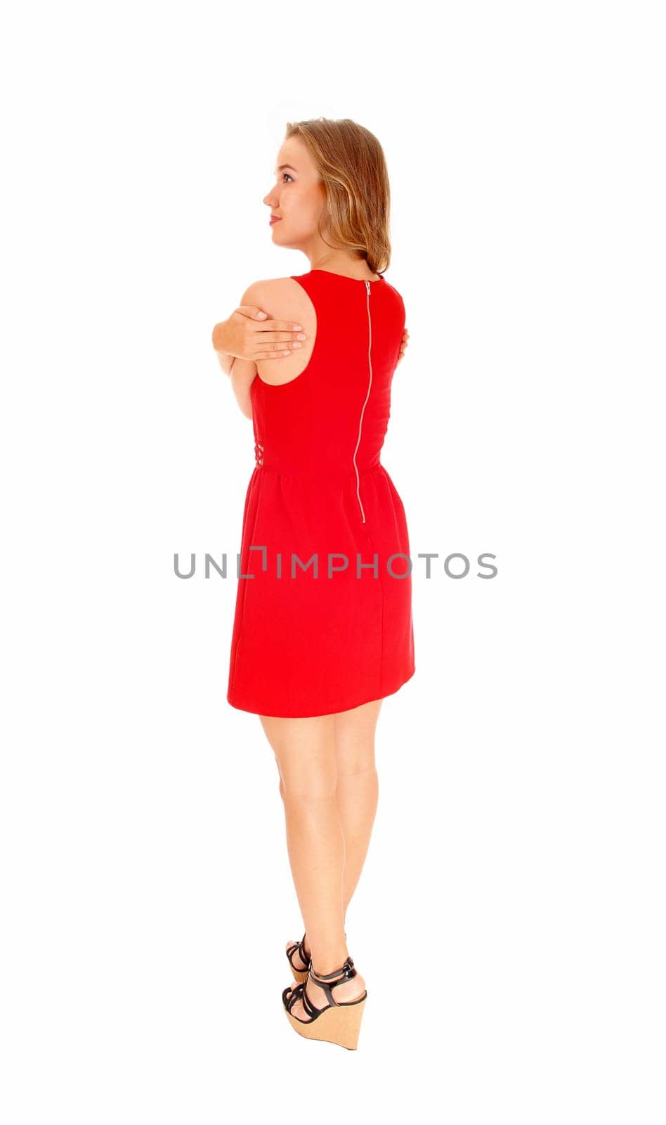 A lovely beautiful young woman standing in a red dress from the back, .looking, isolated for white background..