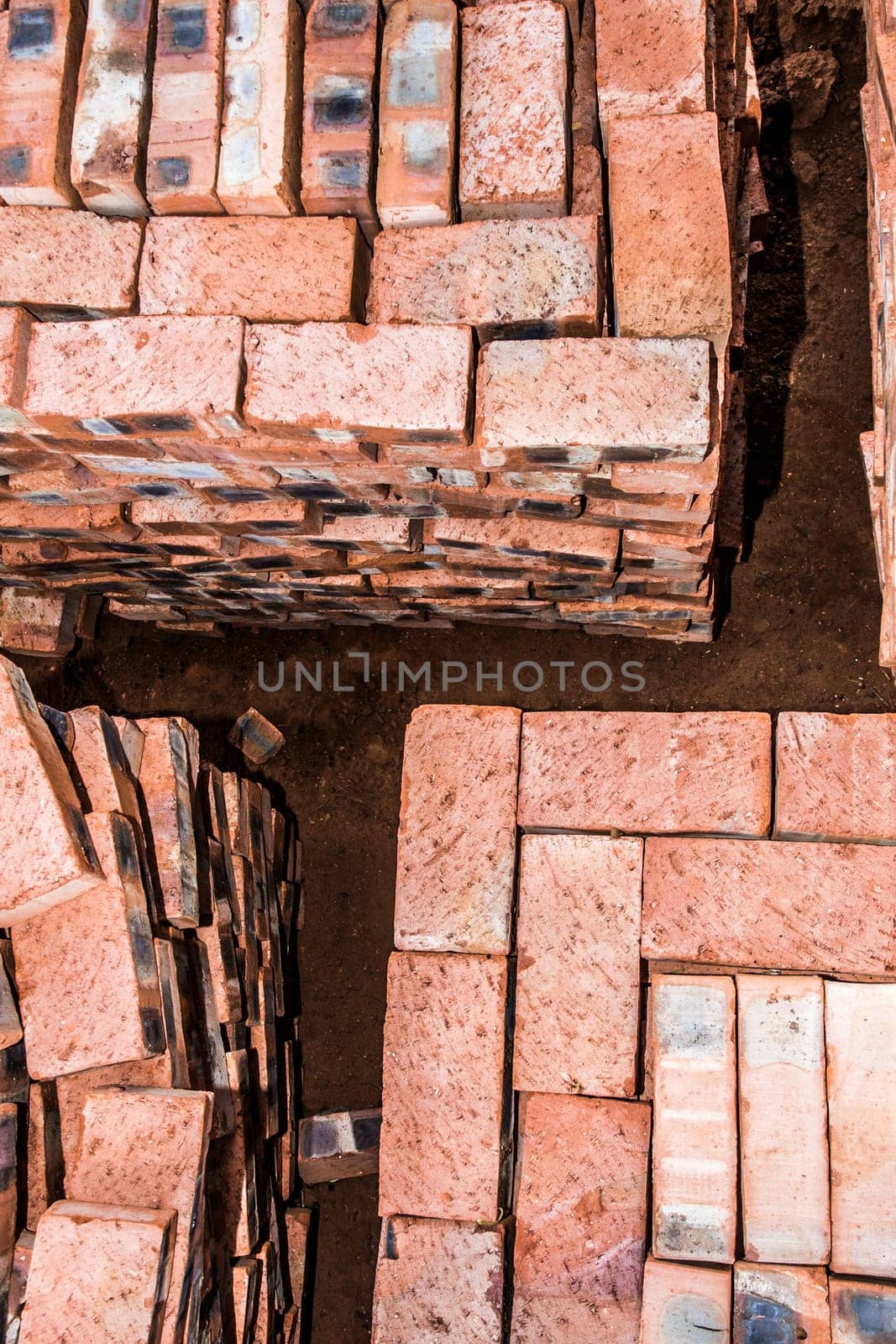 A top view of stacked bricks, ready for the builder to use on compelting the new house.