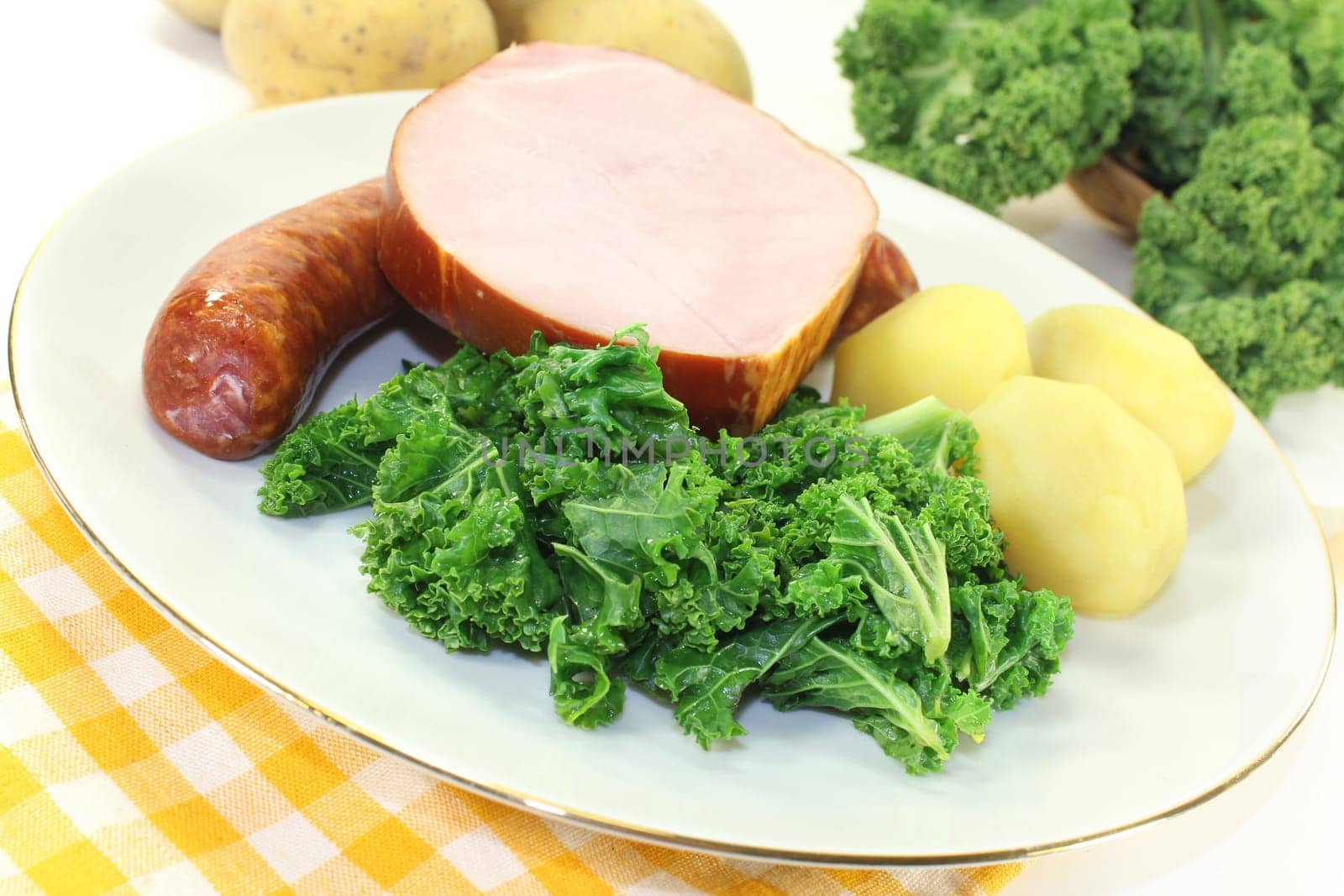 a plate with kale cassler and pinkel