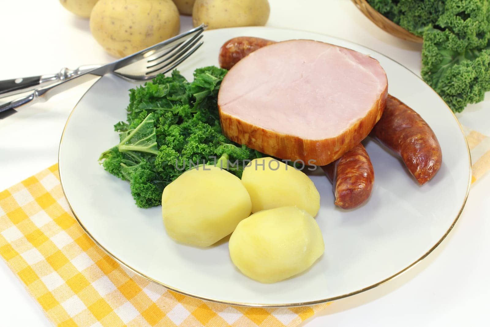 a plate with kale cassler and pinkel
