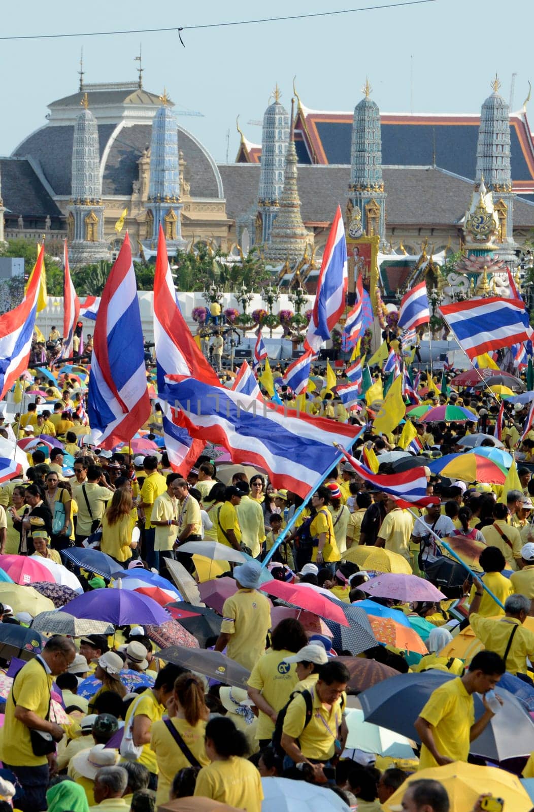 Tousends of Thai People at the ceremony of the coronation Day of the King Bhumibol on the Sanam Square Park on the 5. May in the city of Bangkok in Tahiland, Southeastasia.