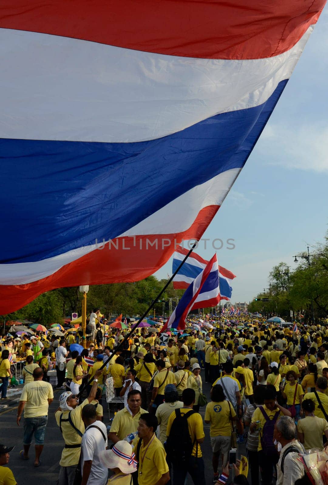 Tousends of Thai People at the ceremony of the coronation Day of the King Bhumibol on the Sanam Square Park on the 5. May in the city of Bangkok in Tahiland, Southeastasia.