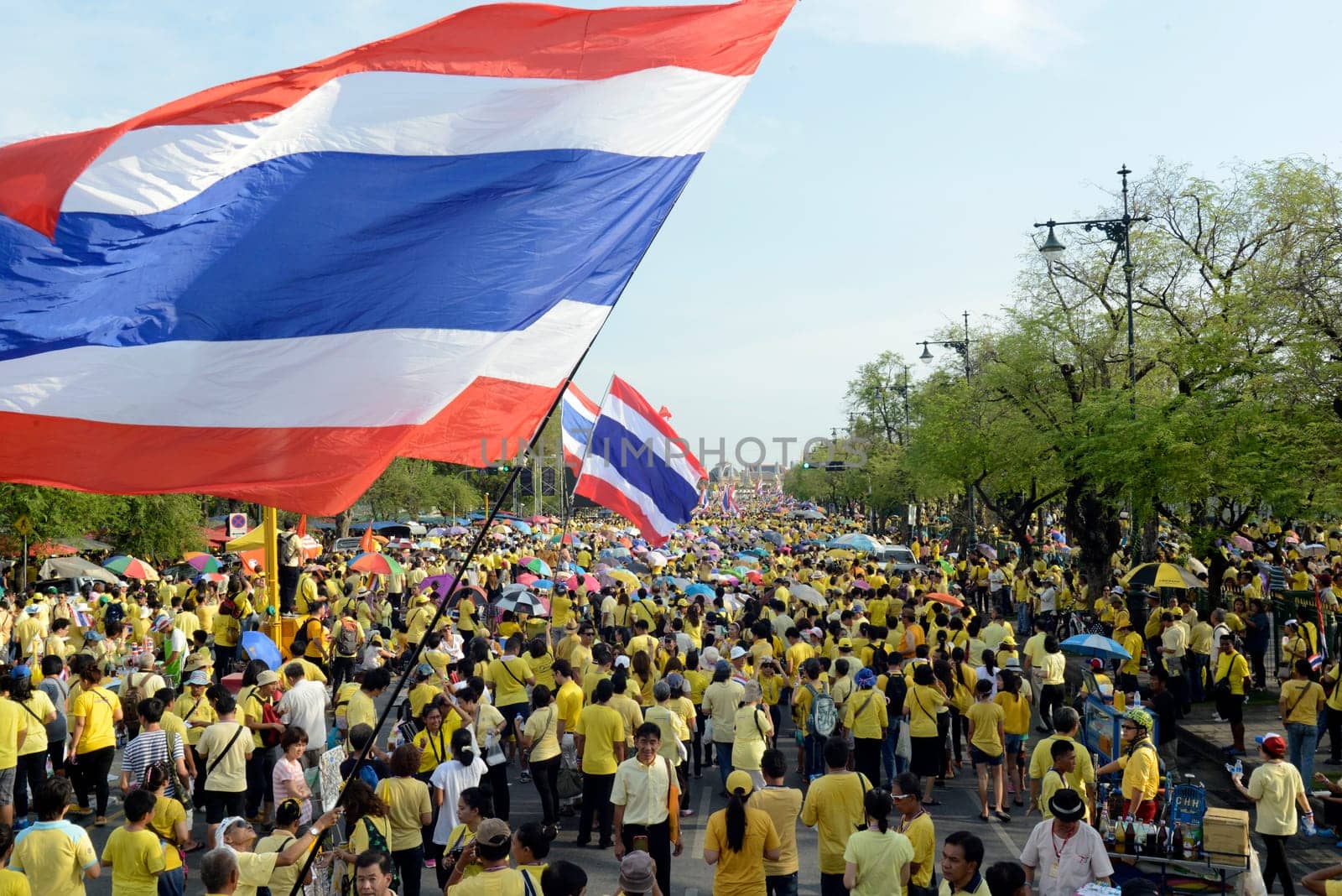 Tousends of Thai People at the ceremony of the coronation Day of the King Bhumibol on the Sanam Square Park on the 5. May in the city of Bangkok in Tahiland, Southeastasia.