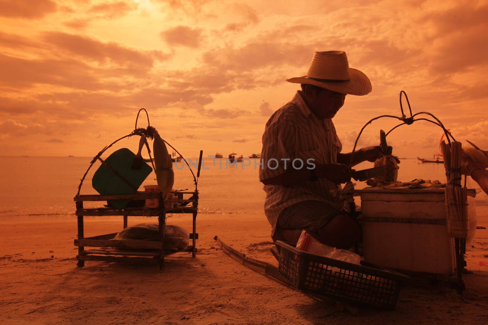 a men cocking thai food at the Beach at Hat Sai Ri on thel Ko Tao Island in the Gulf of Thailand in the southeast of Thailand in Southeastasia.