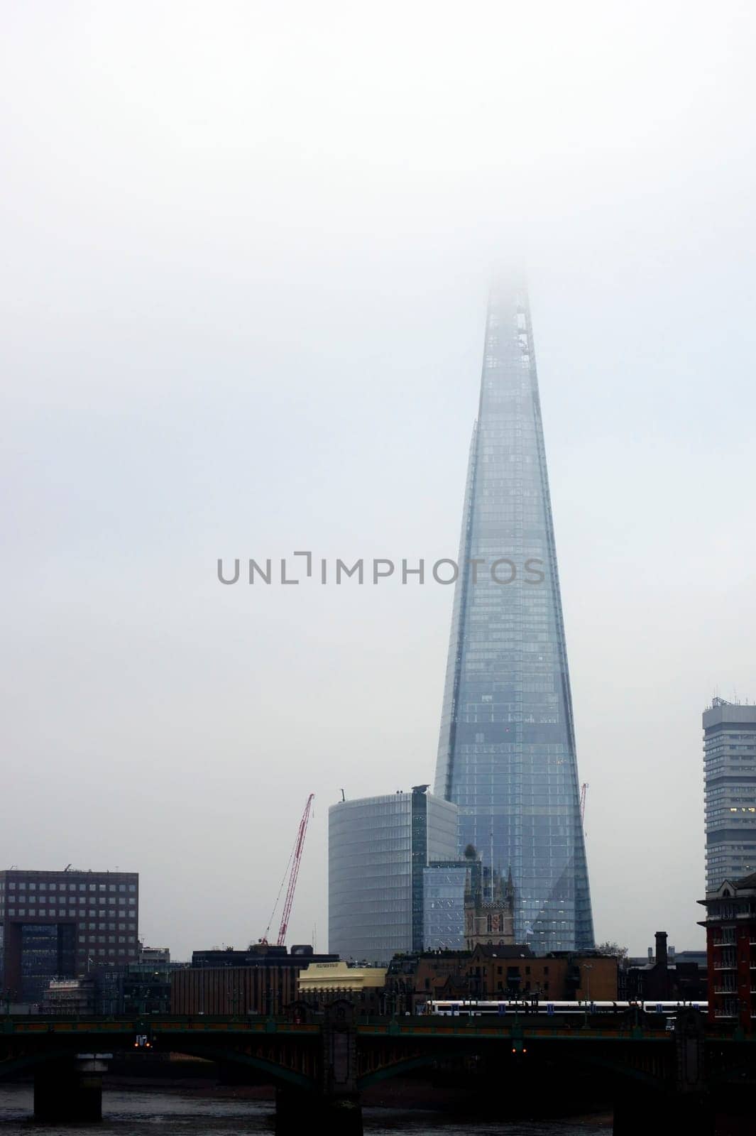 The Shard,a London skyscraper in the fog.