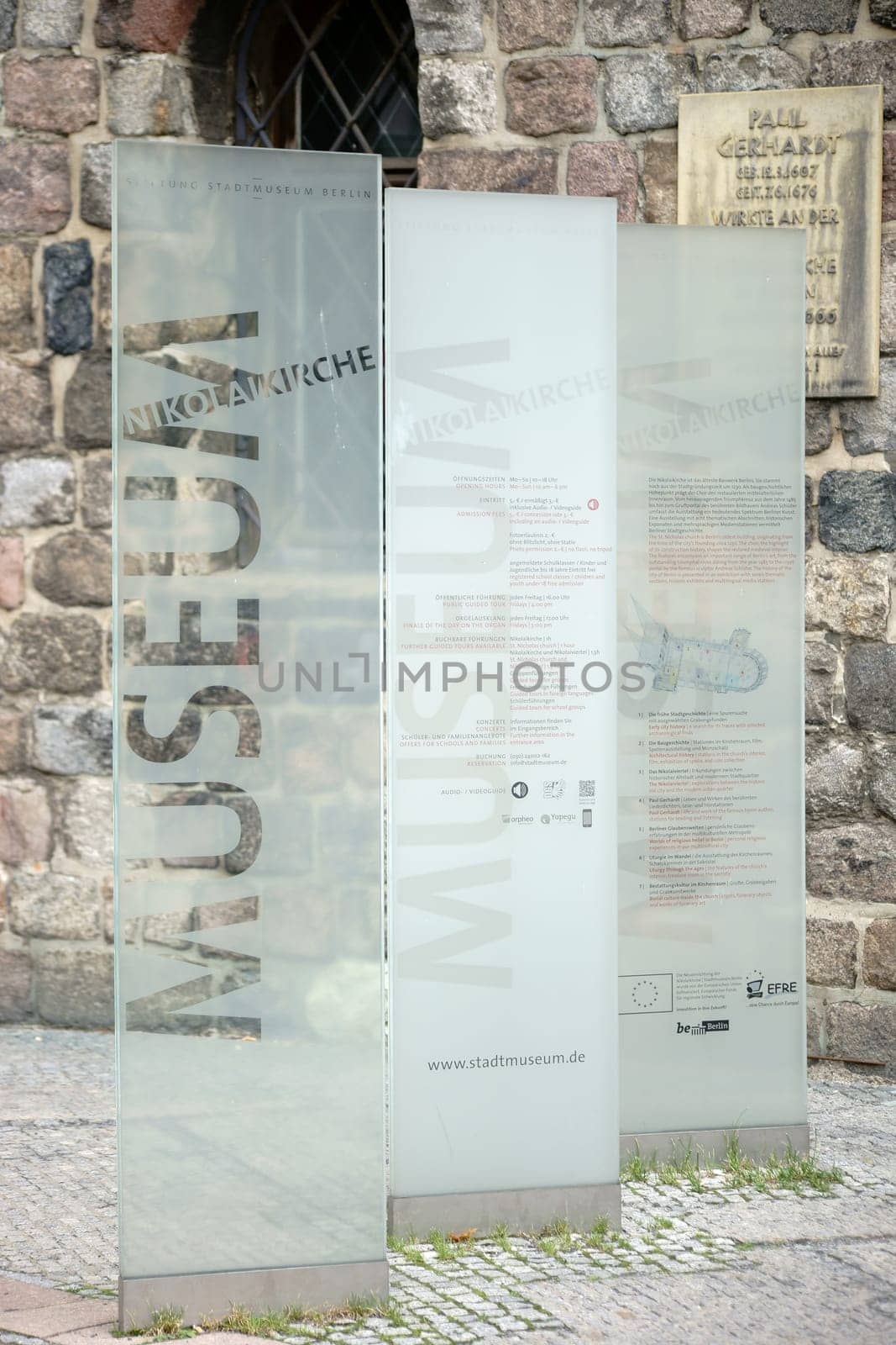 Berlin,Germany - June 21,2016: Labeled glass information boards in front of the Nikolaikirche in front of the entrance to the museum on June 21,2016 in Berlin.