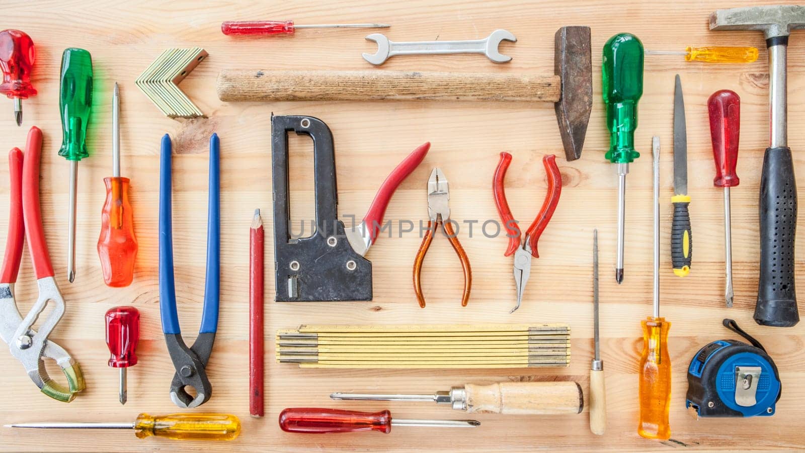 Various tools for crafting on a rustic background made of wood