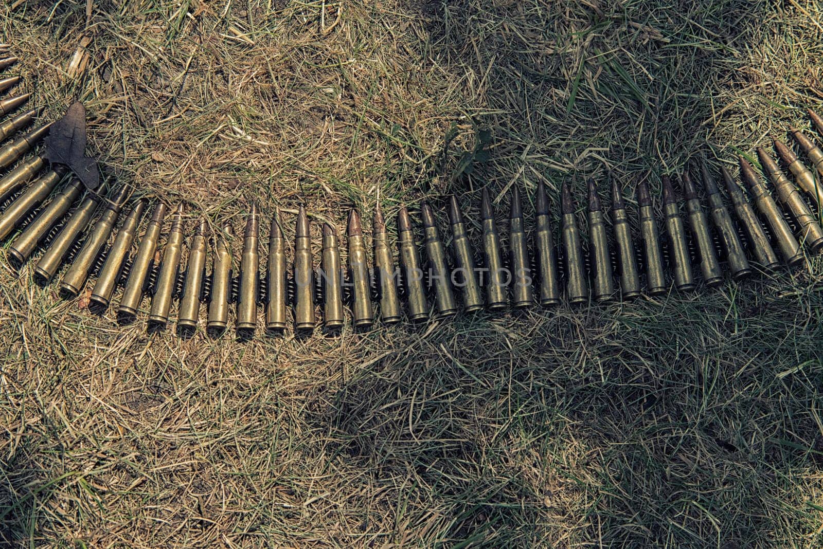 ammo to machine guns on grass,hdr