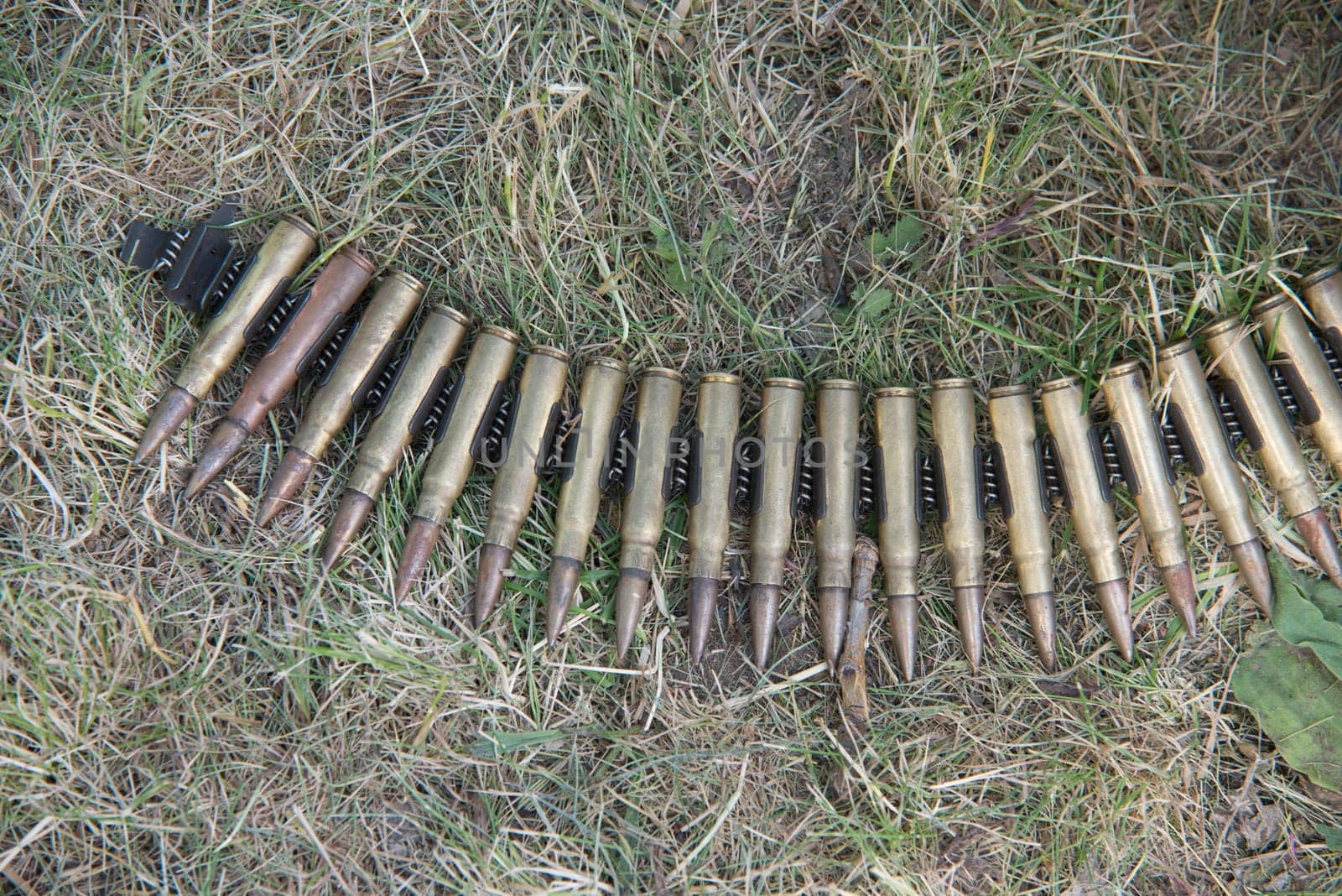 ammo to machine guns on grass
