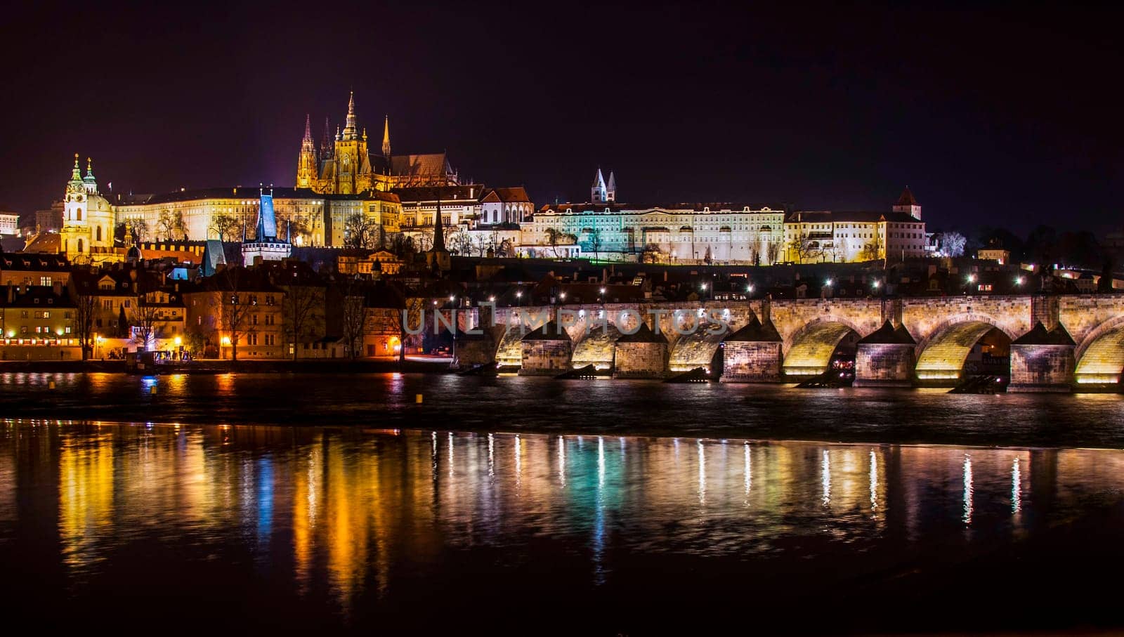 castle,charles bridge and vltava river,night panorama of prague,czech republic