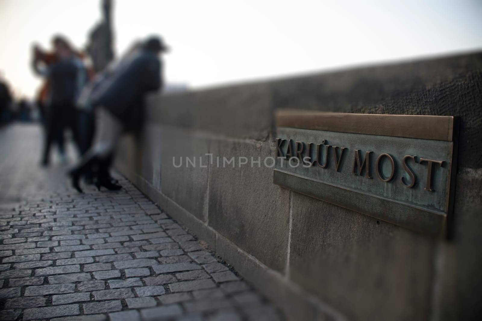type,board,model,build,travel,city,town,stone,bridge,tourism,attraction,wall,word,prague,metal,style of construction,architecture,architectural style,inscription,destination,letter,medieval,sign,urban,landmark,old,ancient,name,most,spot