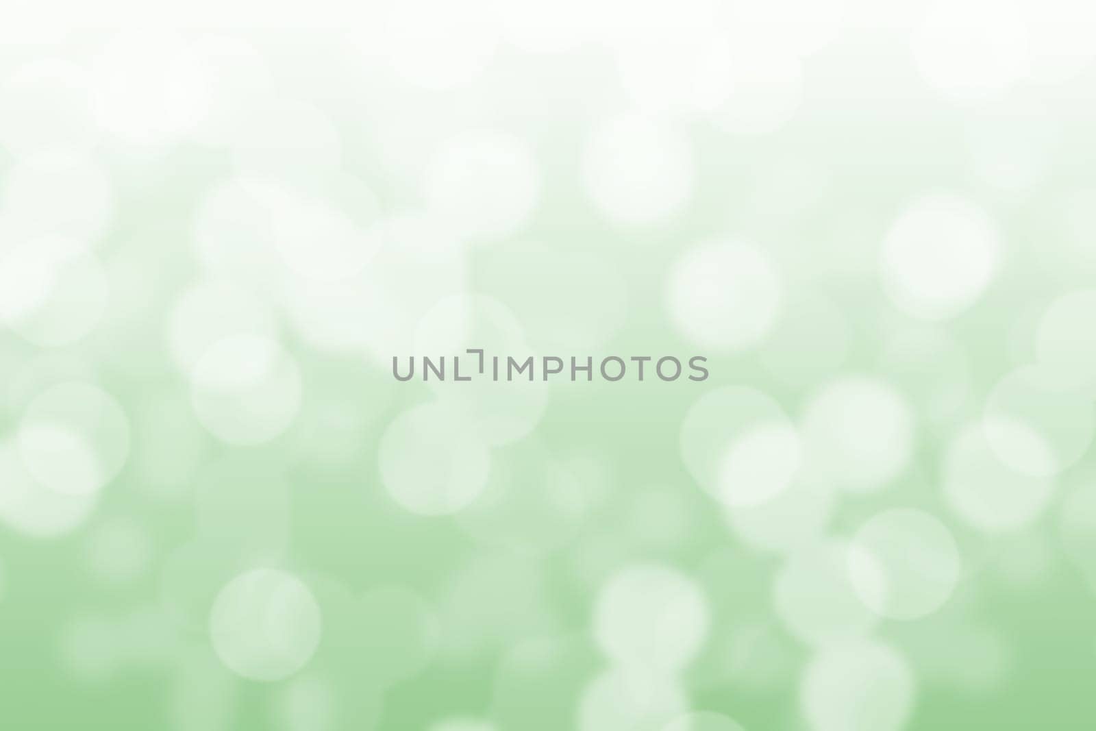 Abstract circular light green and white bokeh background