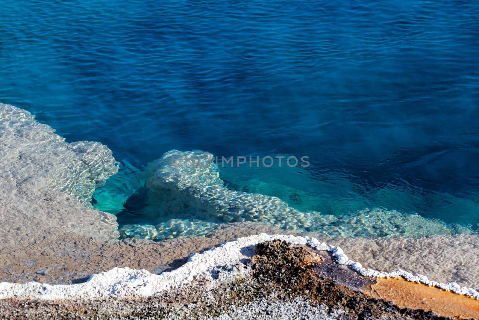 The edge of Black Pool at West Thumb Geyser Basin in Yellowstone National Park