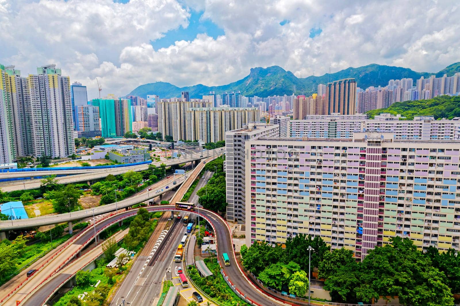 hong kong public estate with landmark lion rock at day