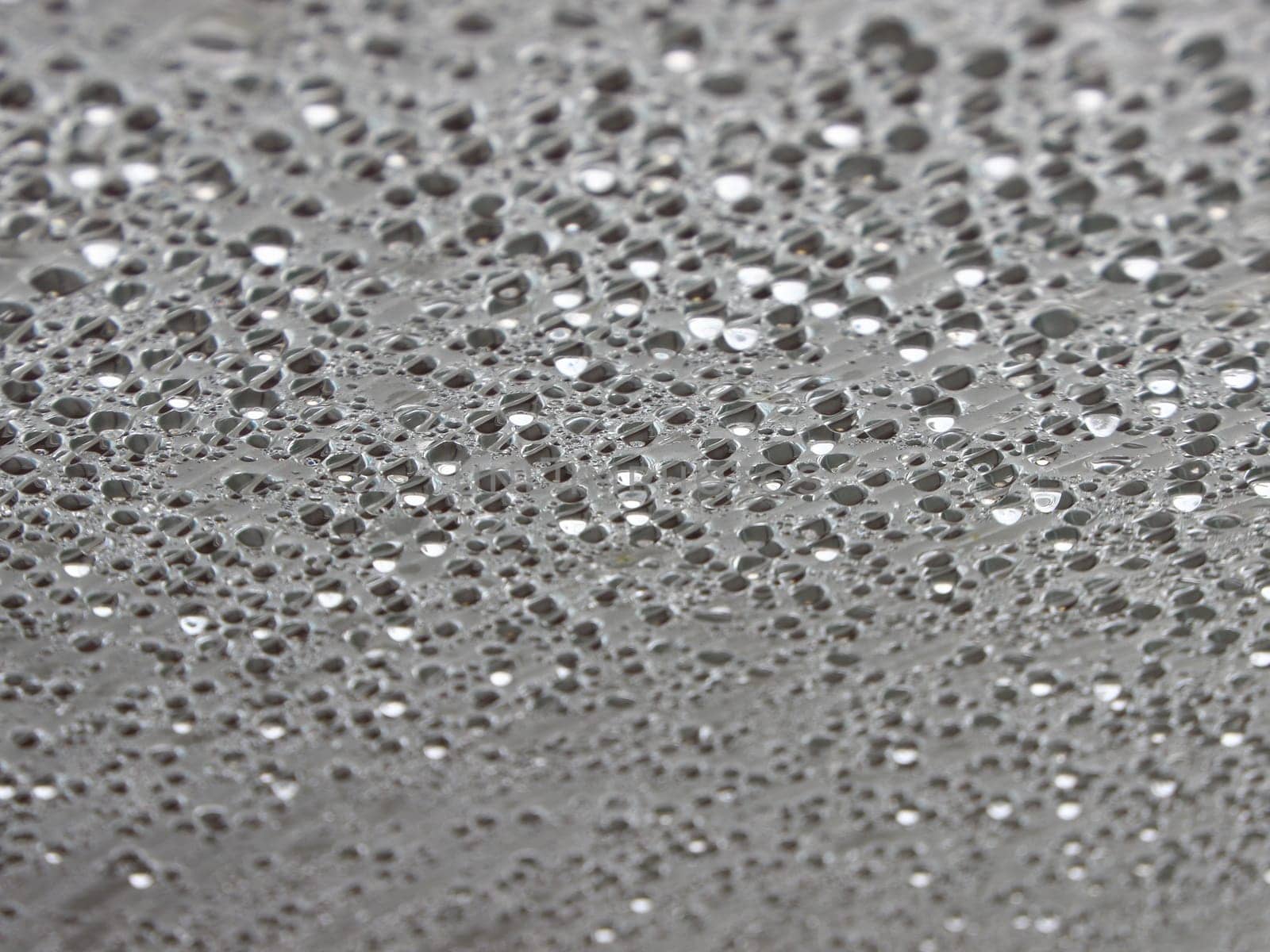 Water Damp Moisture Condensation under Striped Plastic Roof in a Small Outdoor Swimming Pool. Cold outside - but Warm Inside.