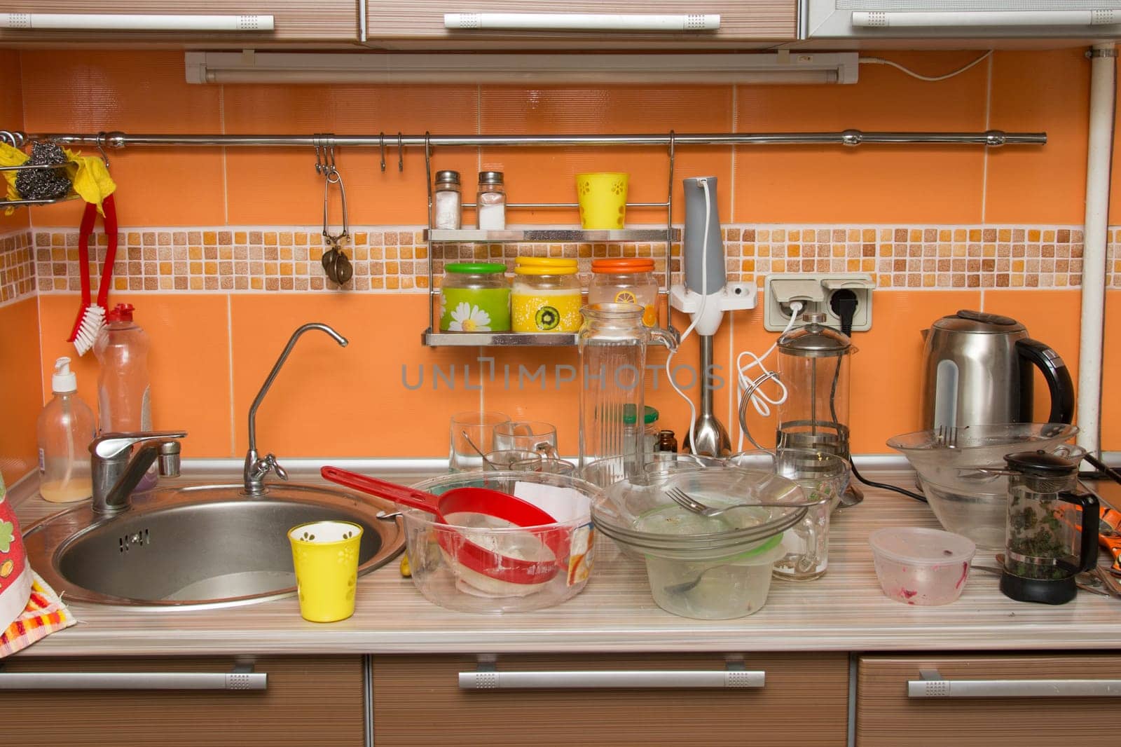 A pile of dirty dishes in the kitchen