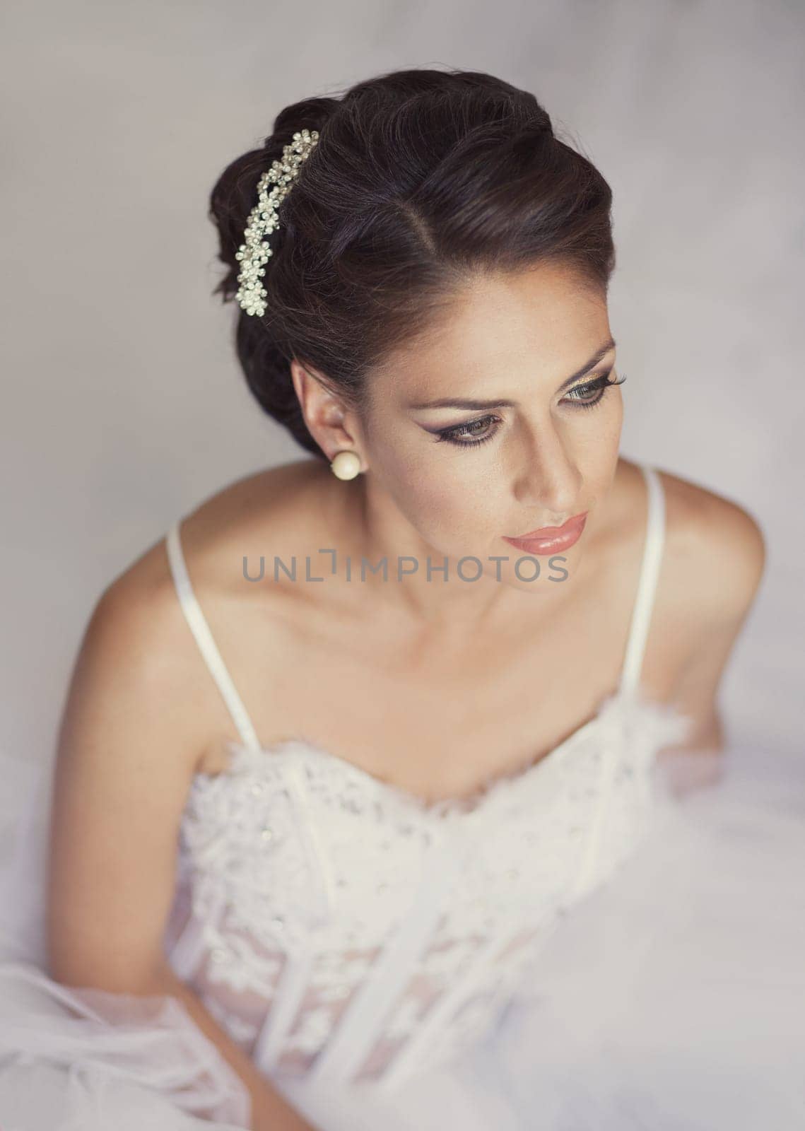 Portrait of Beautiful Bride in Wedding Dress and Decoration.