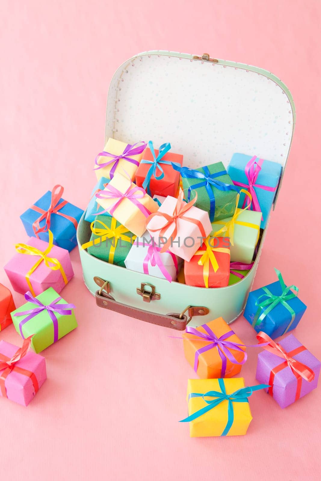 Small gifts wrapped in colorful paper with small ribbons