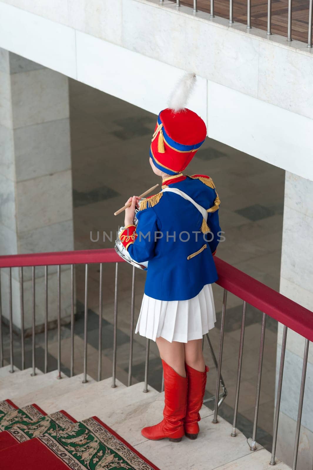 girl, drummer in the form of a hussar on holidays