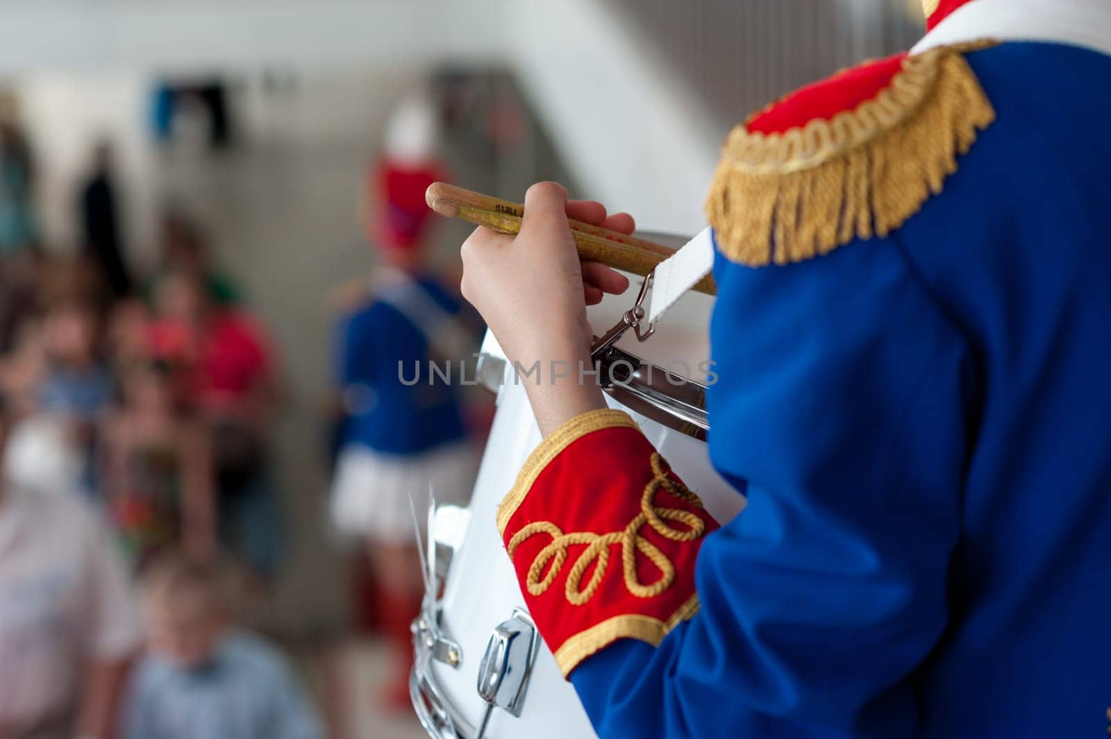 girl, drummer in the form of a hussar on holidays