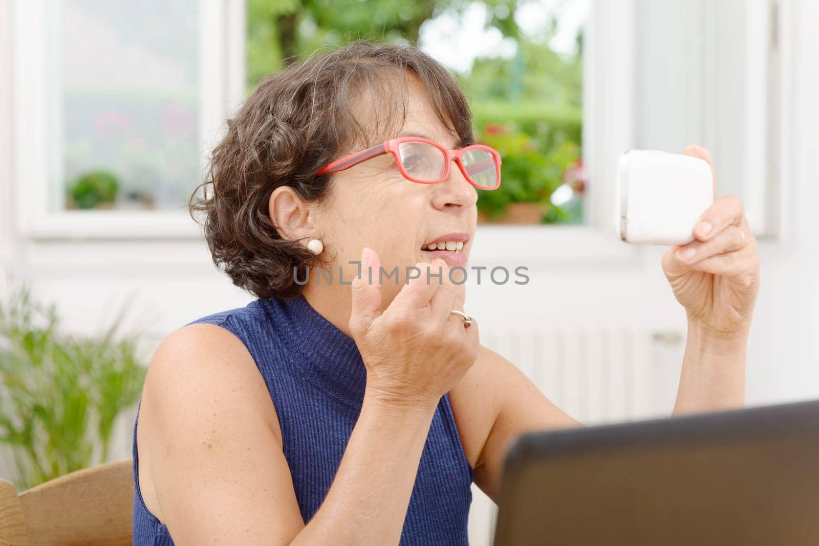 a portrait of a mature woman with a phone