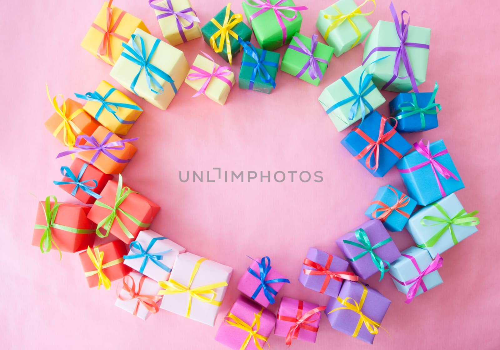 Small gifts wrapped in colorful paper with small ribbons