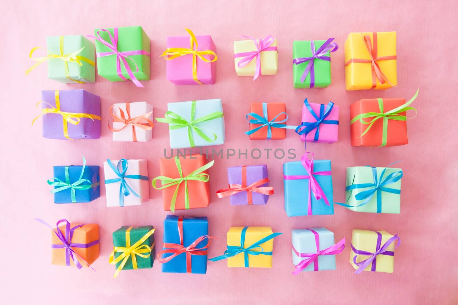 Small gifts wrapped in colorful paper with small ribbons