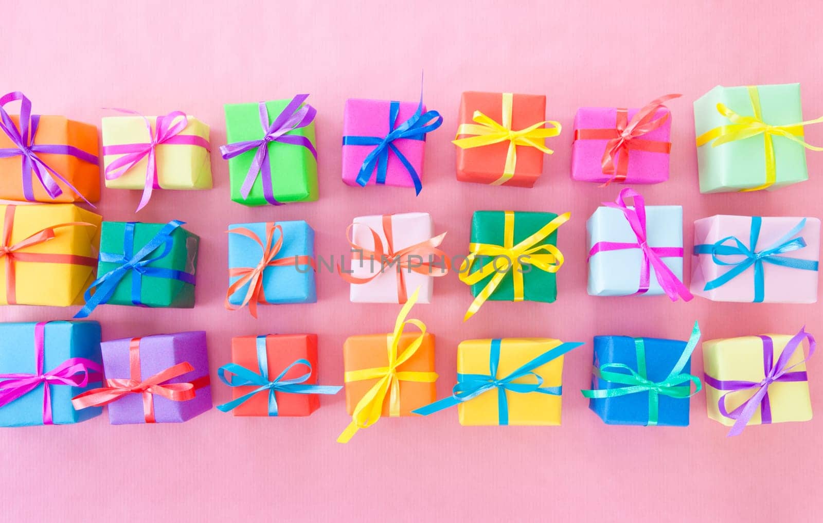 Small gifts wrapped in colorful paper with small ribbons