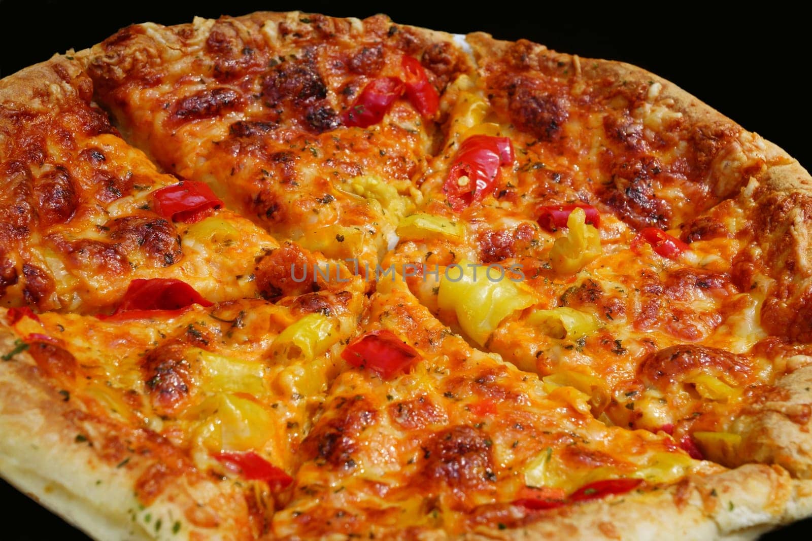 Fresh pizza on a black background