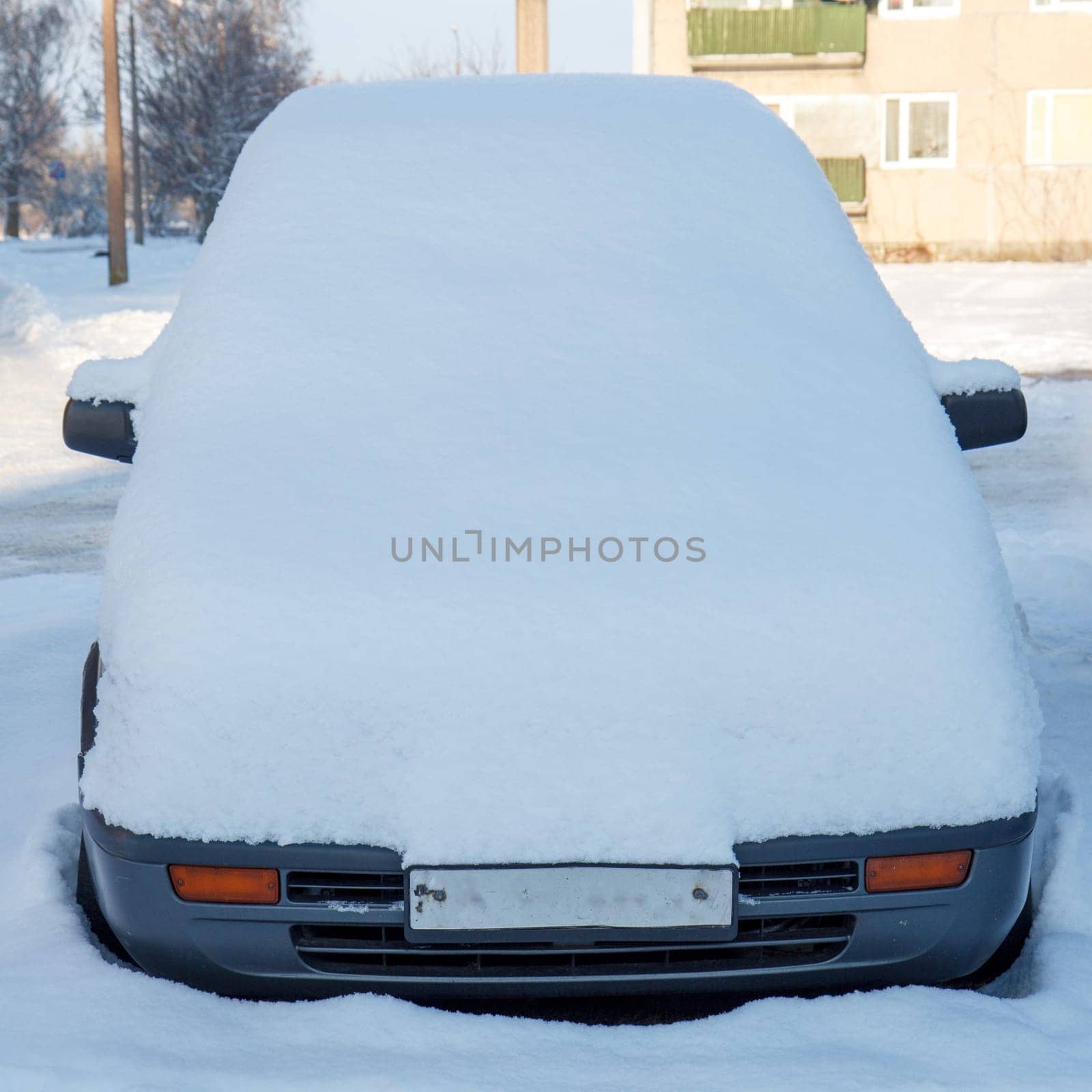 car fully covered with a fresh snow