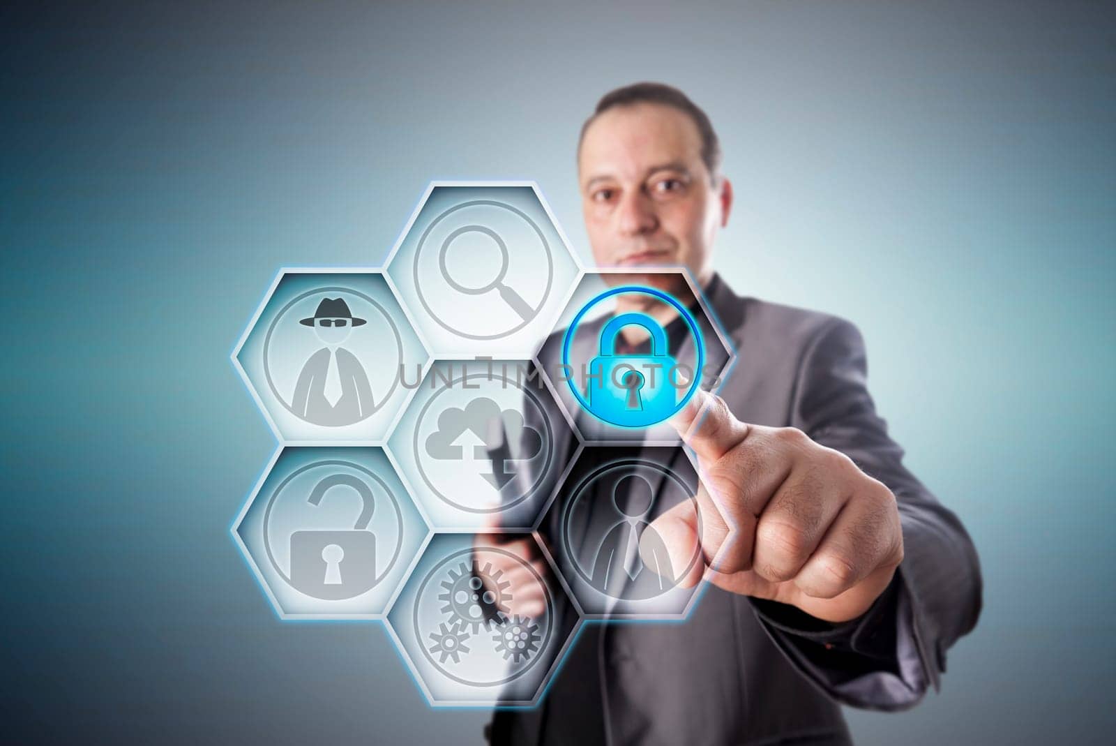 Business man in gray suit locking a virtual padlock for fraud prevention. Business concept for protection from data theft, electronic deception, civil and criminal offense perpetrated via internet.