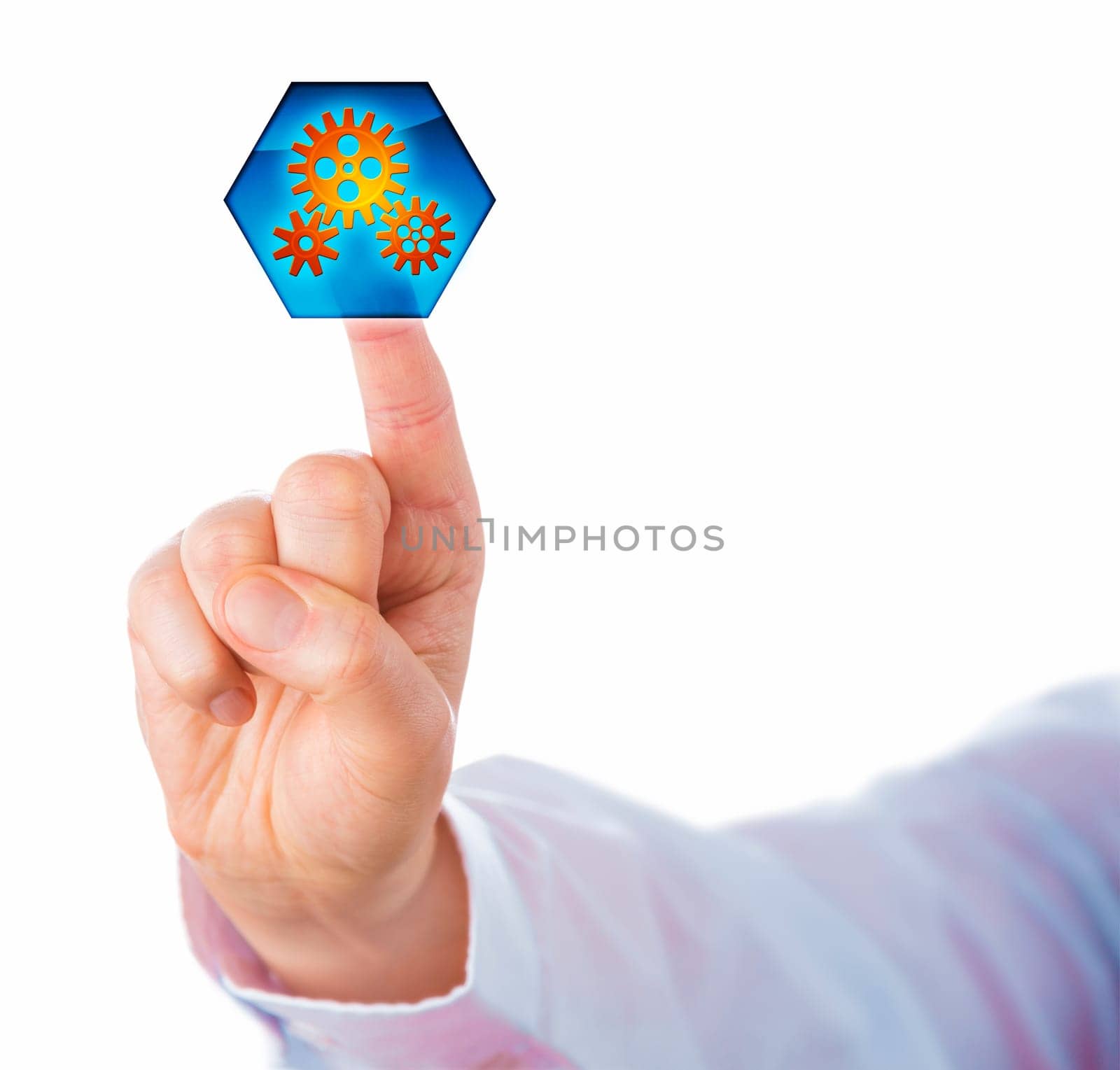 Cutout of a male white collar worker hand with raised index finger touching a hexagonal virtual push button displaying three interlocking cog wheels. Business metaphor for process automation.