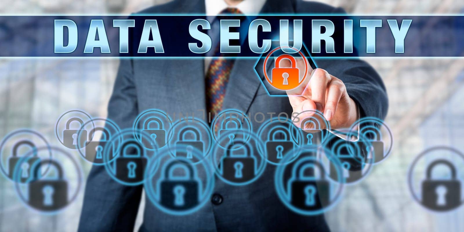 Male corporate executive is pushing DATA SECURITY on a touch screen interface. Business and security industry metaphor. Information technology concept for data management and protection.