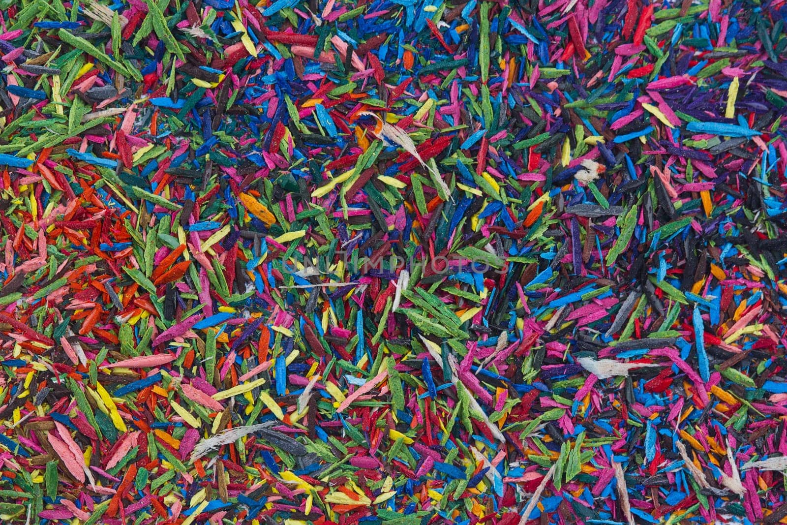Horizontal top view of colorful remains on pencil sharpening