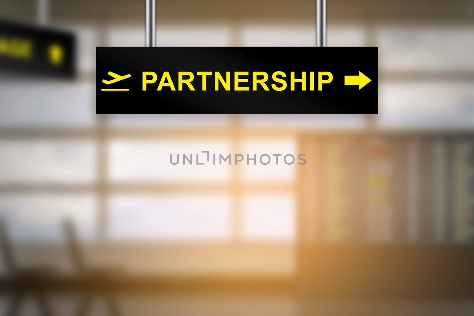 partnership on airport sign board with blurred background and copy space