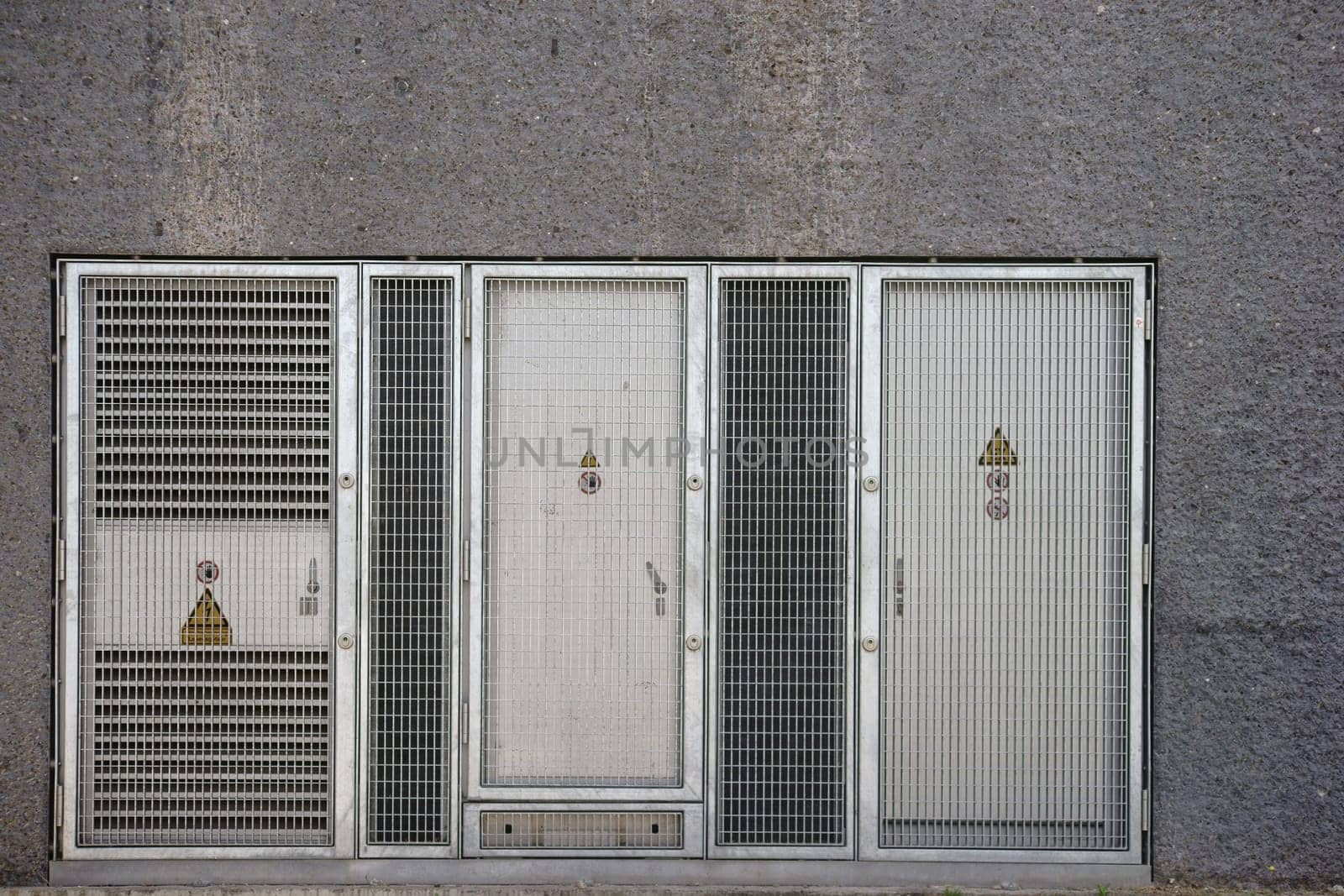 A switch house or a high-voltage system with a warning sign.