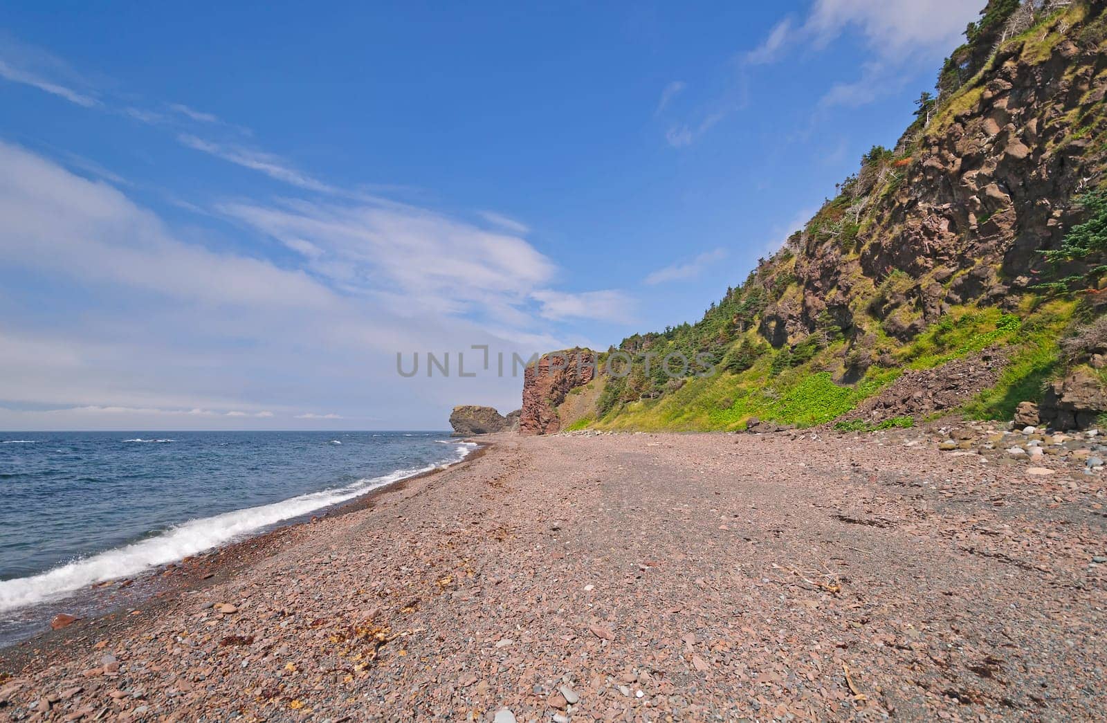 Remote Pebble Beach on a Sunny Day on the Green Gardens Trail in Gros Morne National Park in Newfoundland, Canada