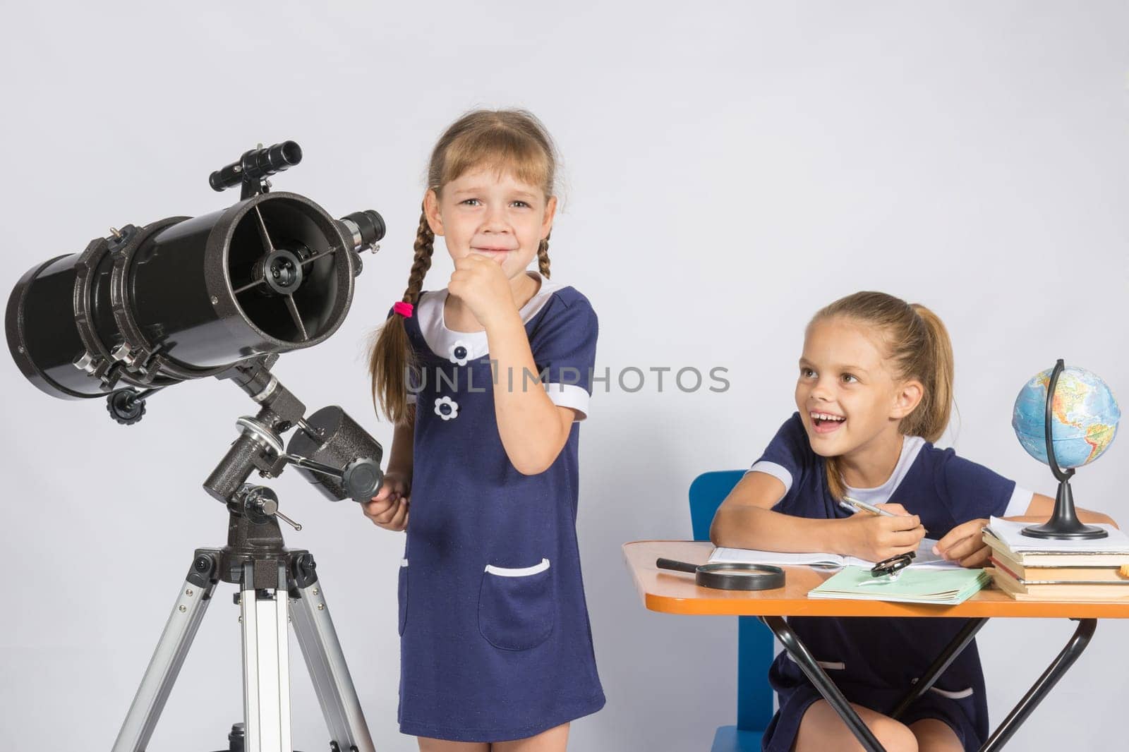 Girl astronomer thought, another girl with a smile looking at her
