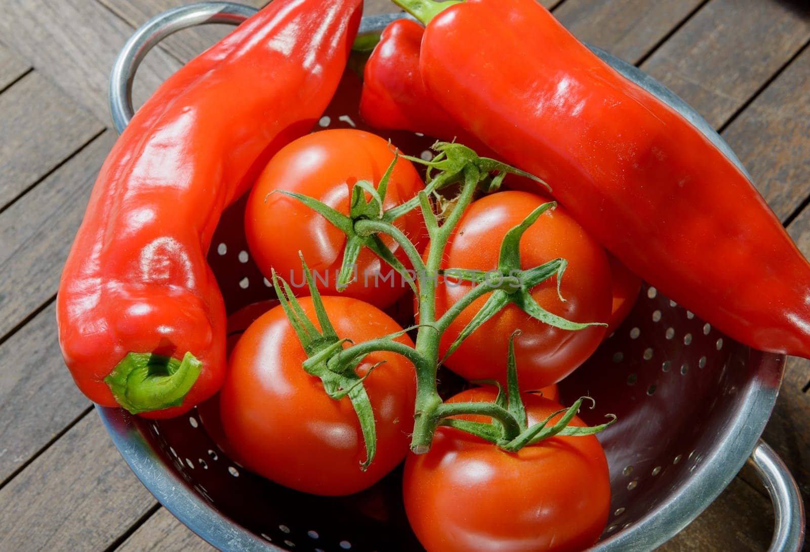 tomatoes and red peppers on table