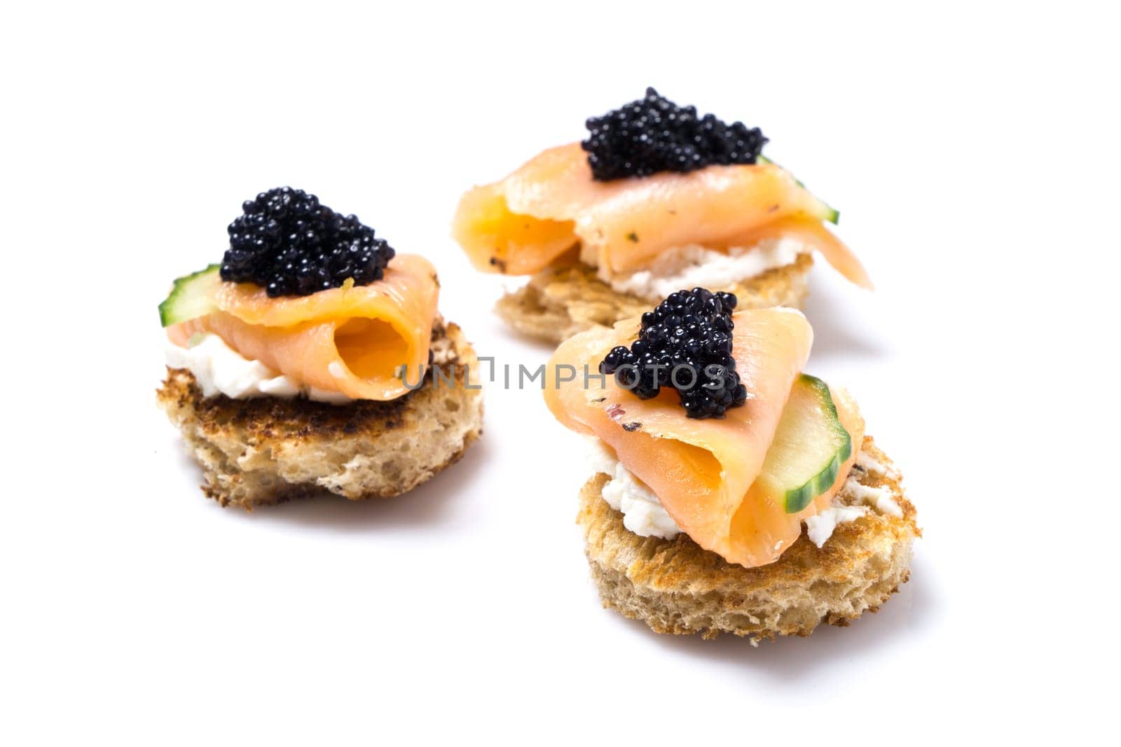 Smoked Salmon Appetizer with Cream Cheese and Caviar isolated on white