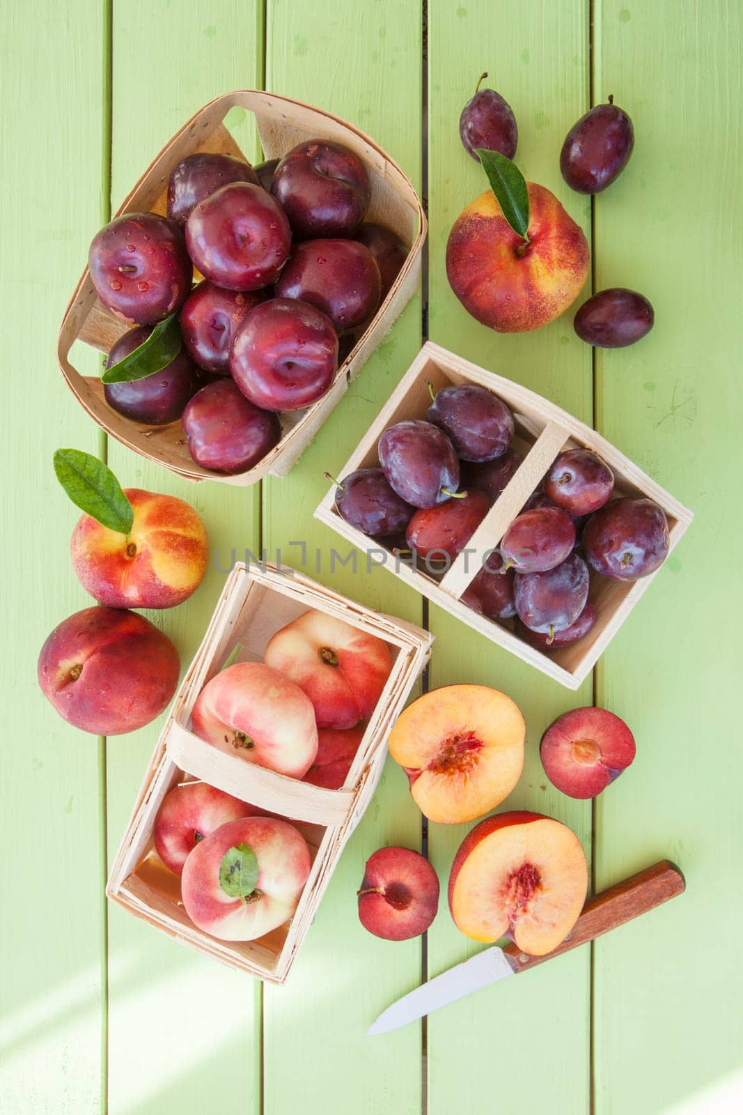 Various fresh stone fruits in small coerblets