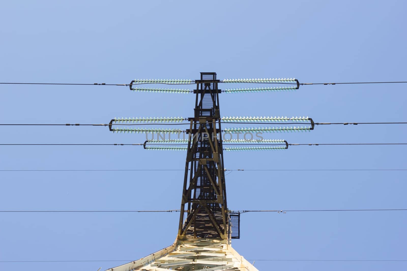 electric insulator on the background of blue sky