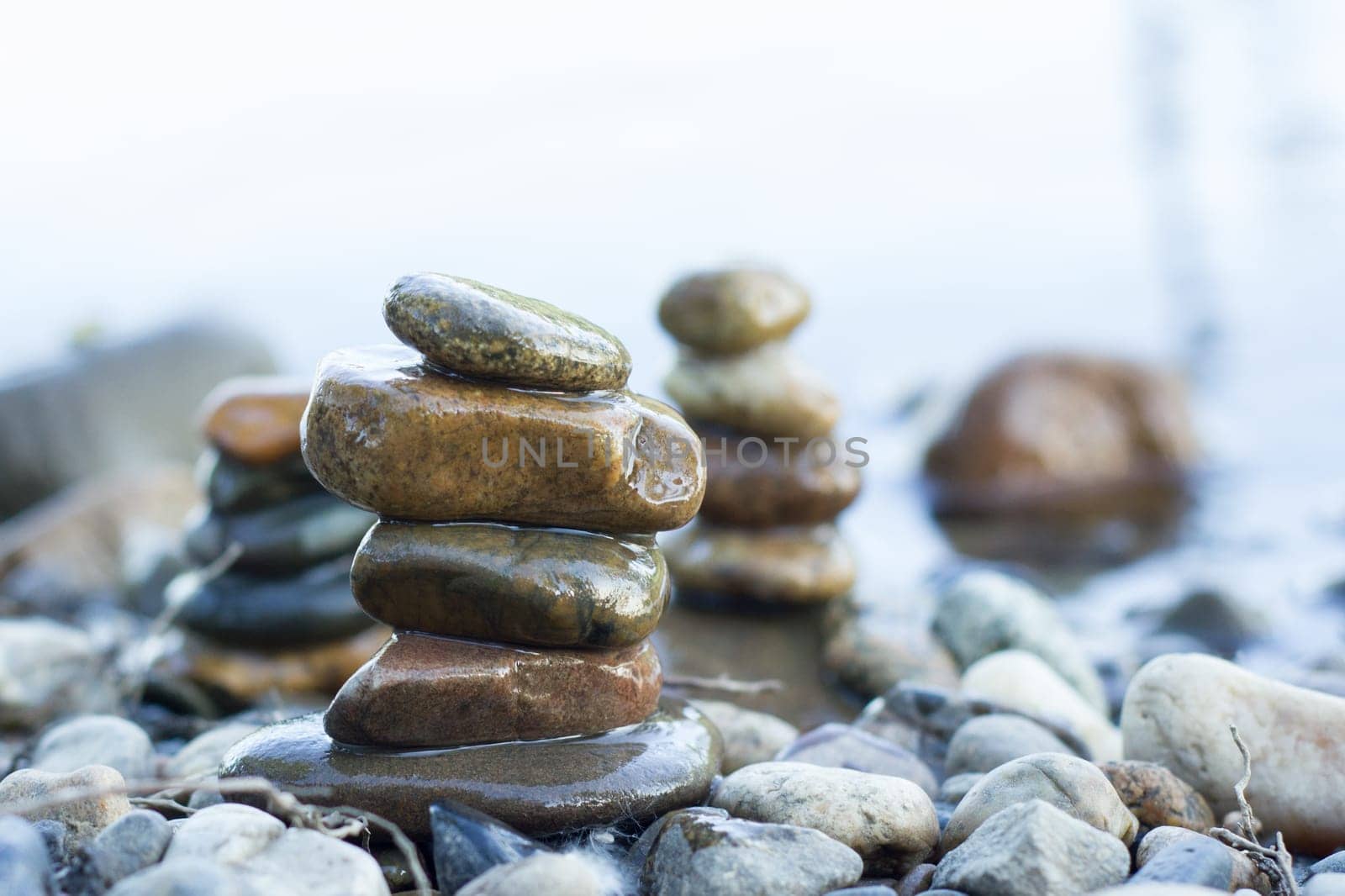 small pyramid of stones on the water