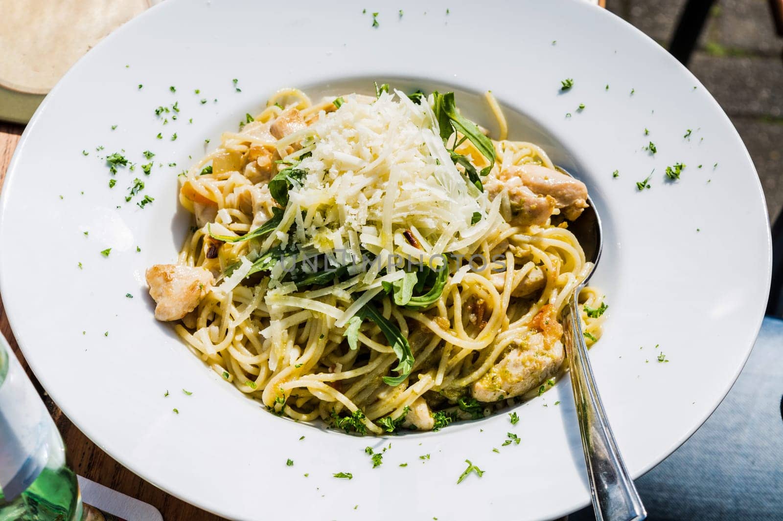 Spaghetti Bolognese. Plates of Italian spaghetti,spinach,chicken and Parmesan cheese..