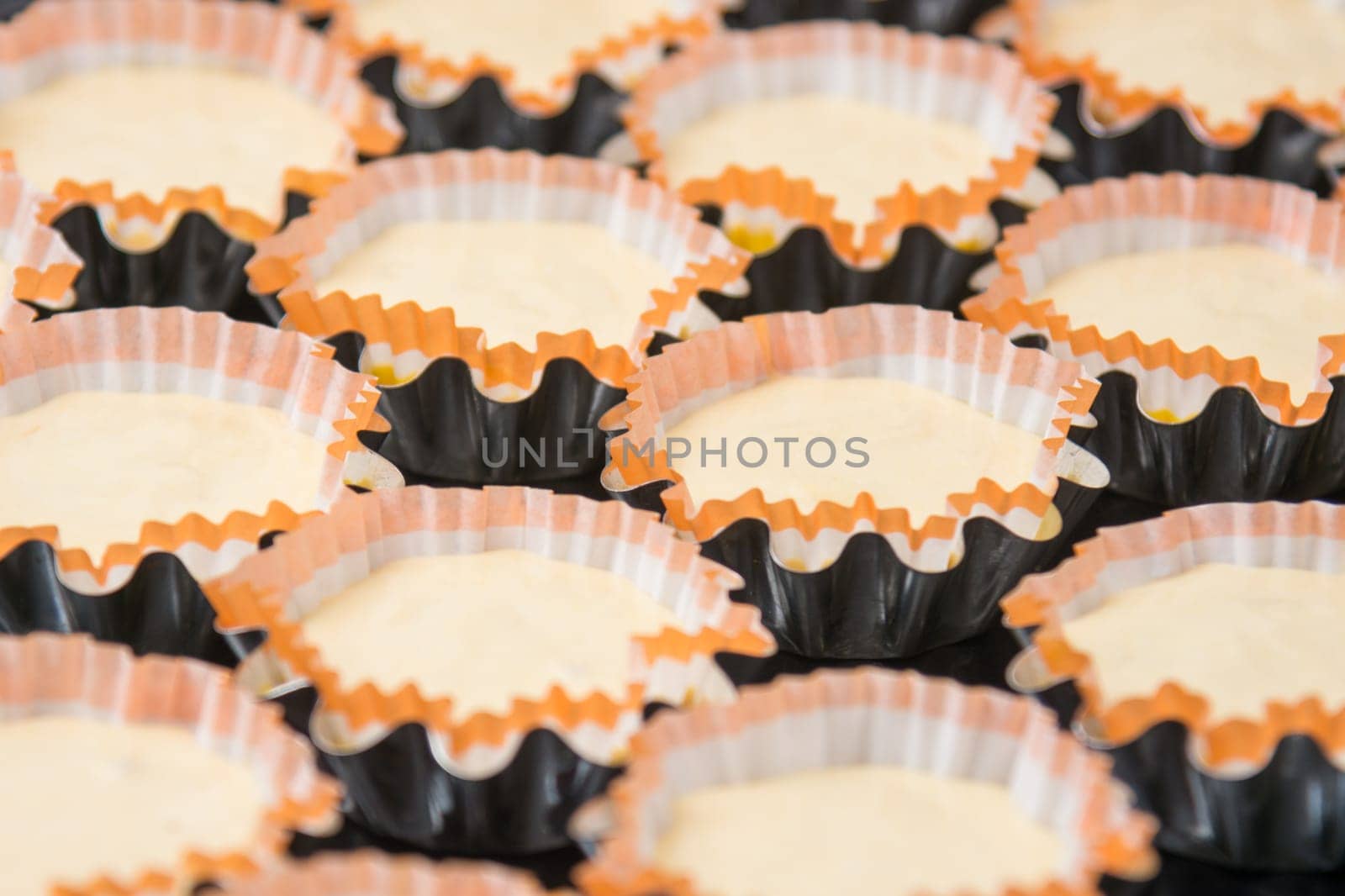 Preparations for baking cakes in molds on a baking sheet