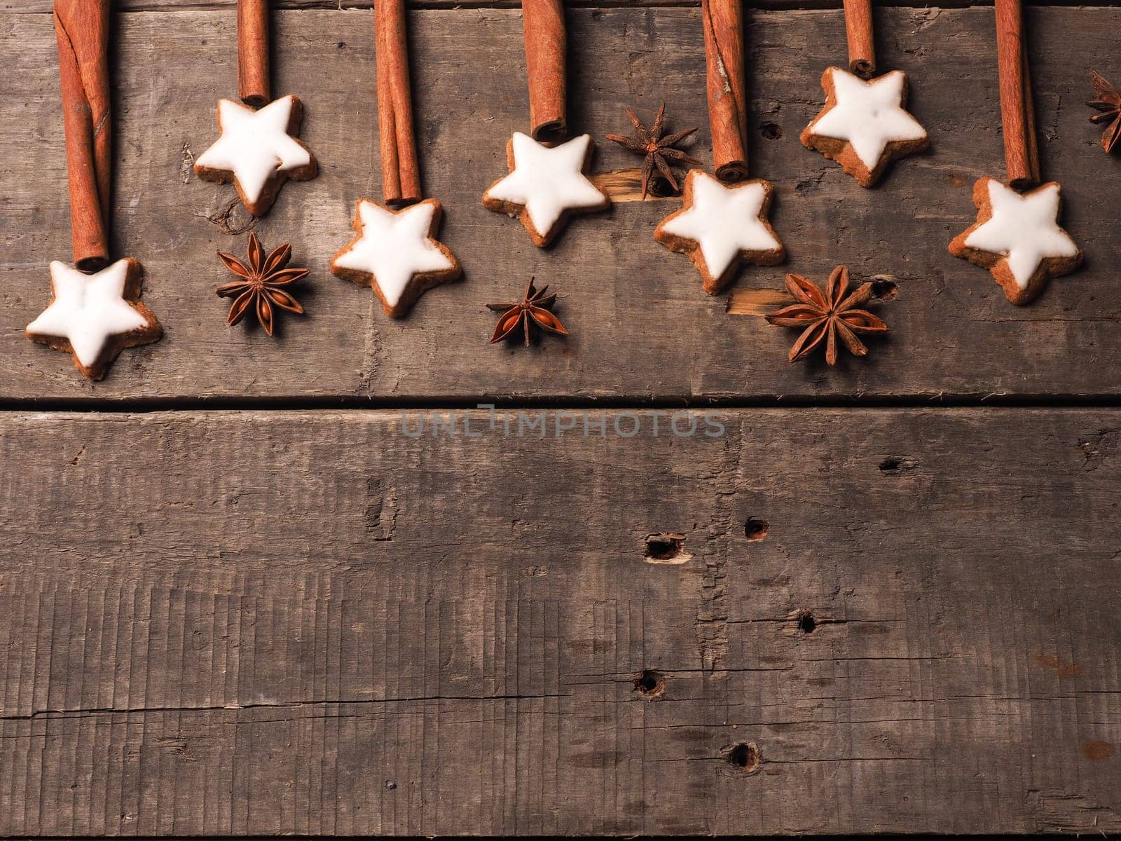 Sweet cinnamon stars with anise on a wooden table