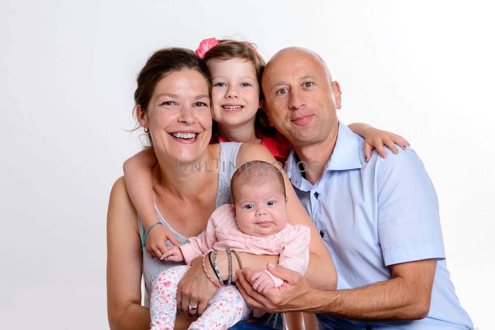 young happy family in front of white background