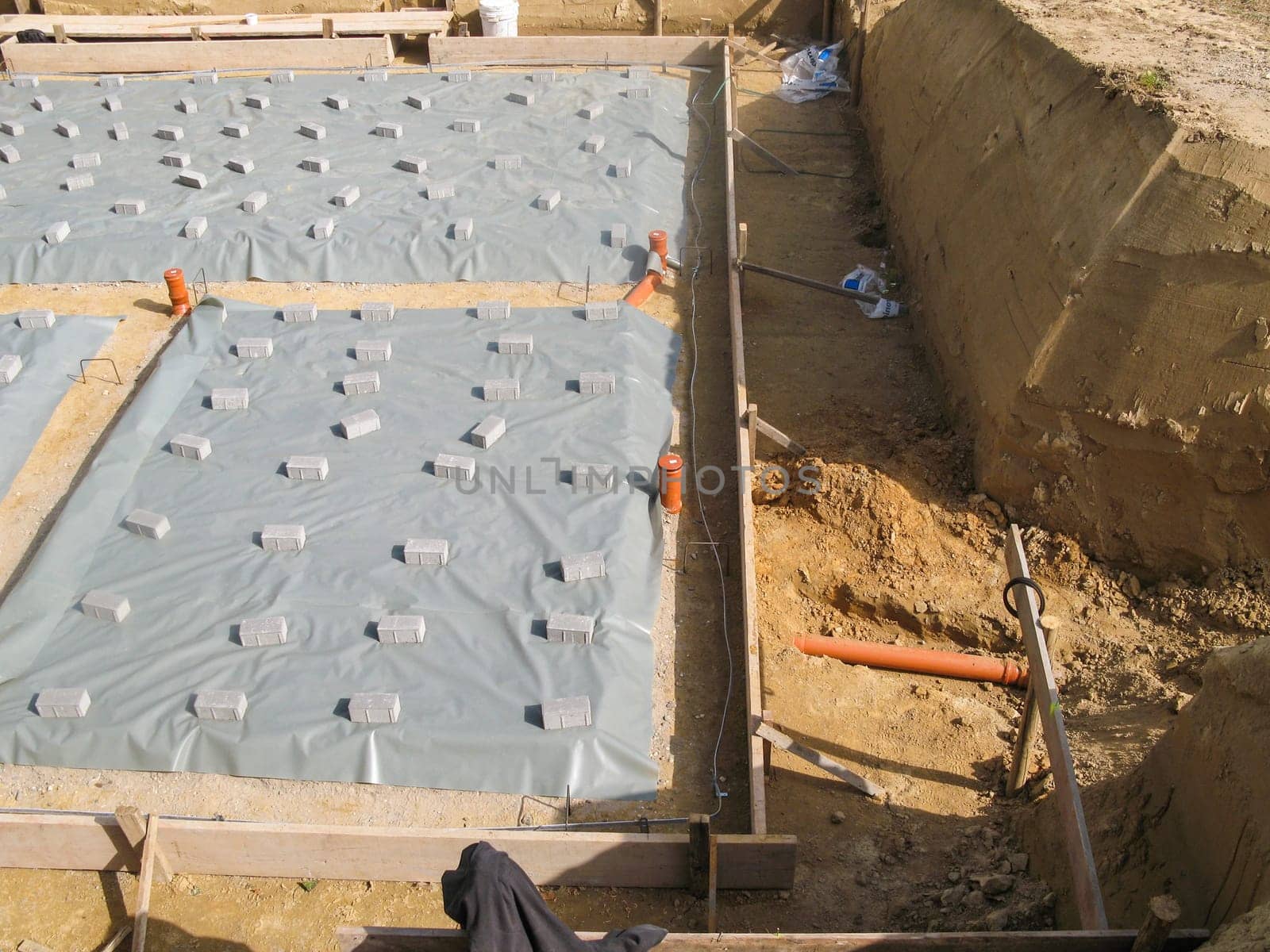 Preparation foundation slab made of concrete in a construction pit for a single-family house