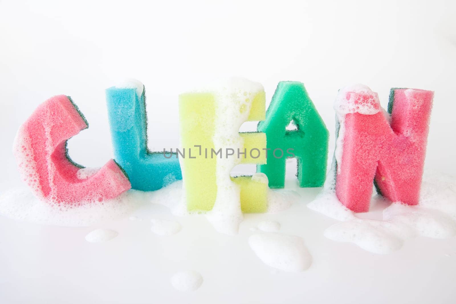 Cleaning sponge as lettering Clean with cleaning agent foam